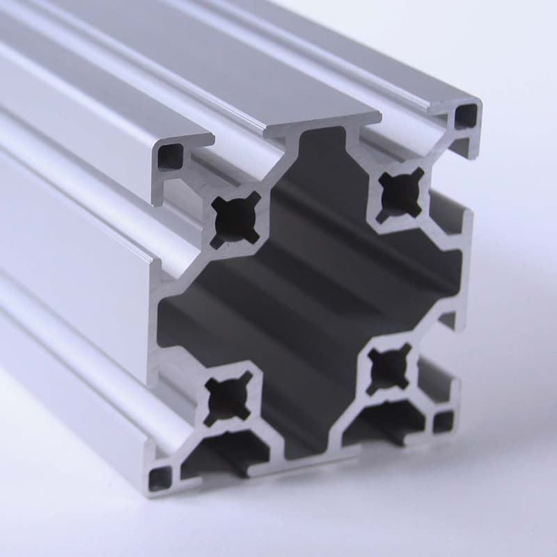 A close up of an aluminum beam on a white surface