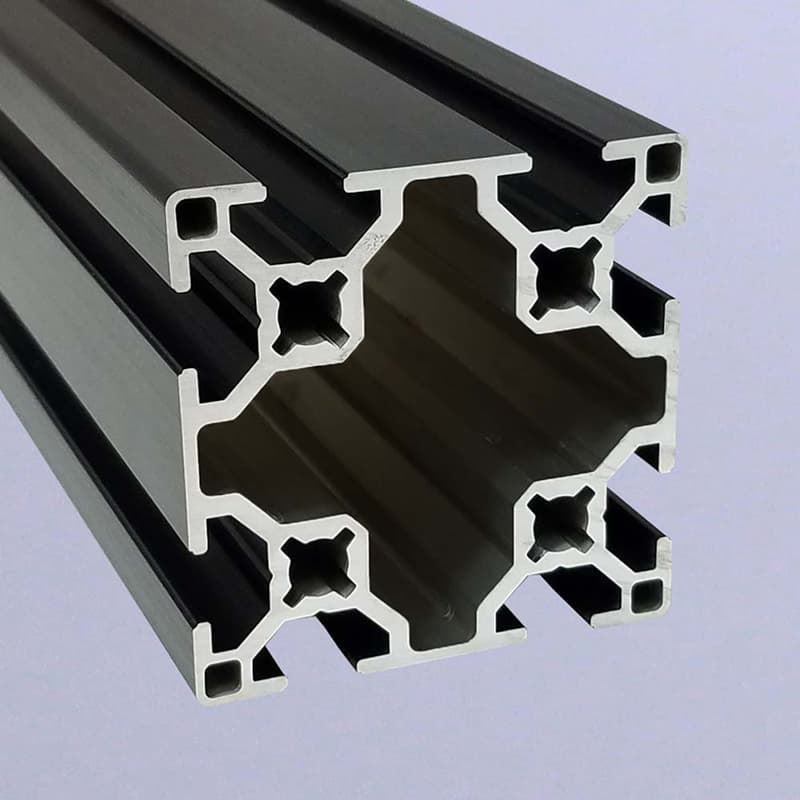 A close up of a black aluminum frame on a white surface