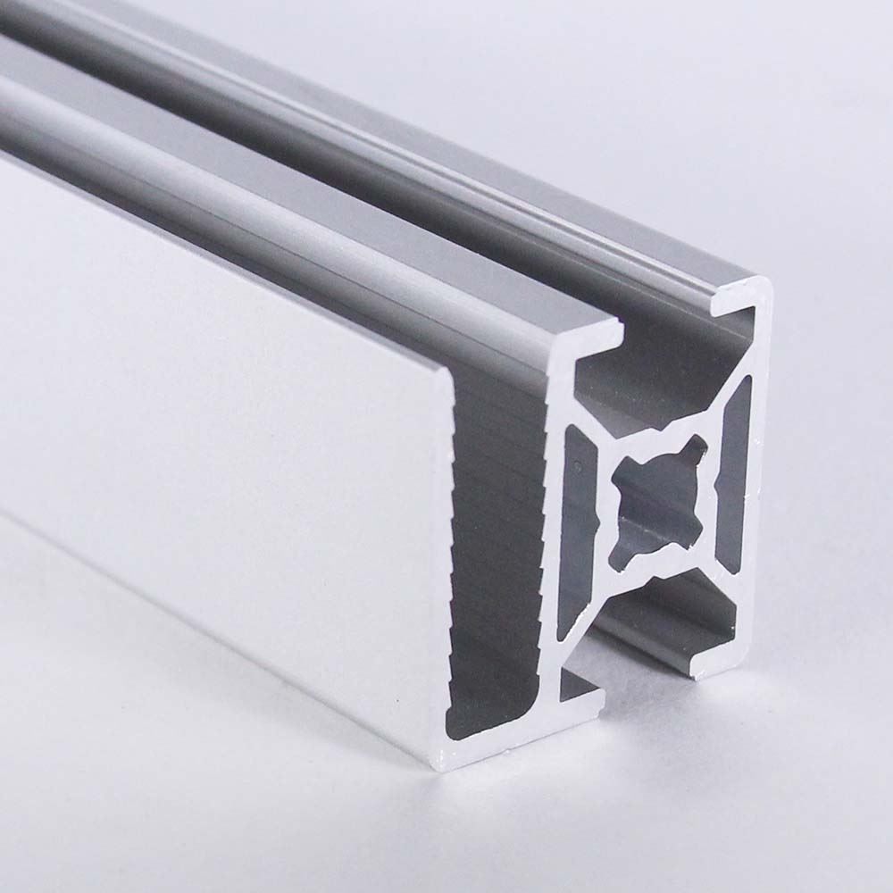 A close up of a piece of aluminum on a white surface