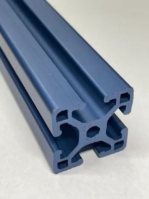 A blue aluminum extrusion is sitting on a white surface.