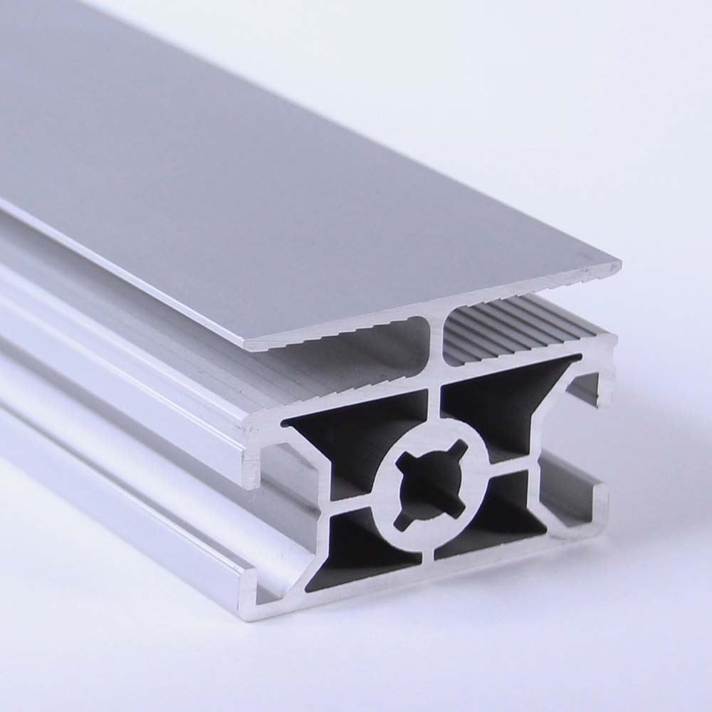 A close up of an aluminum beam on a white surface