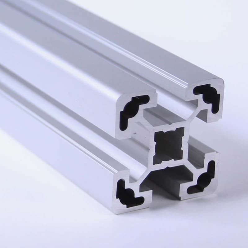 A close up of an aluminum beam on a white surface
