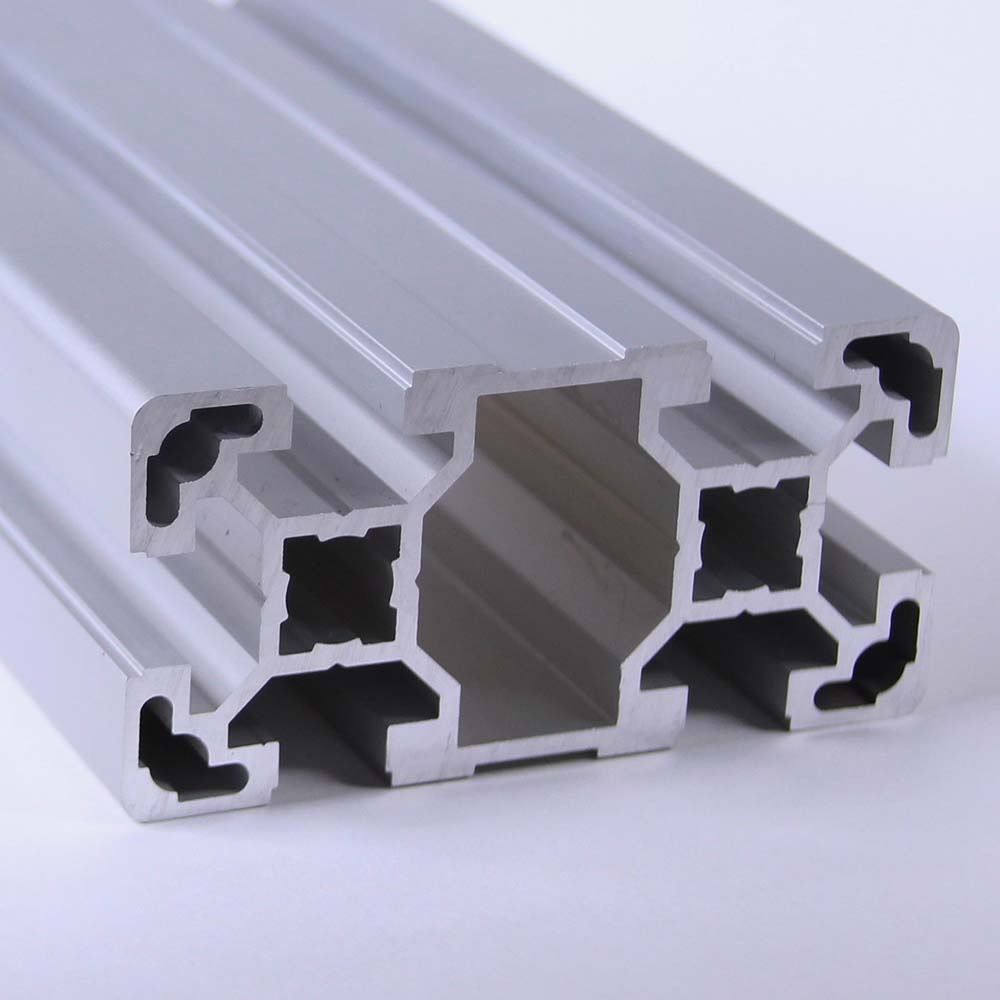A close up of an aluminum beam on a white surface
