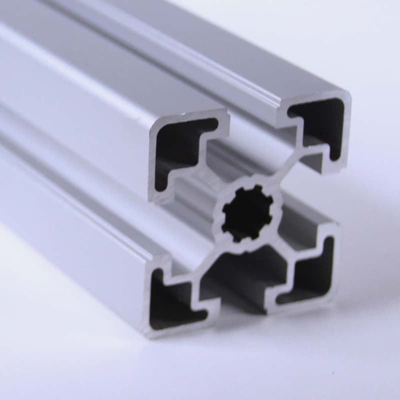 A close up of an aluminum beam on a white surface