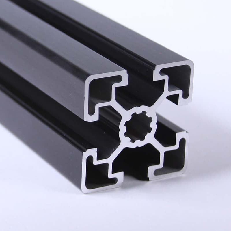 A close up of a black aluminum frame on a white surface