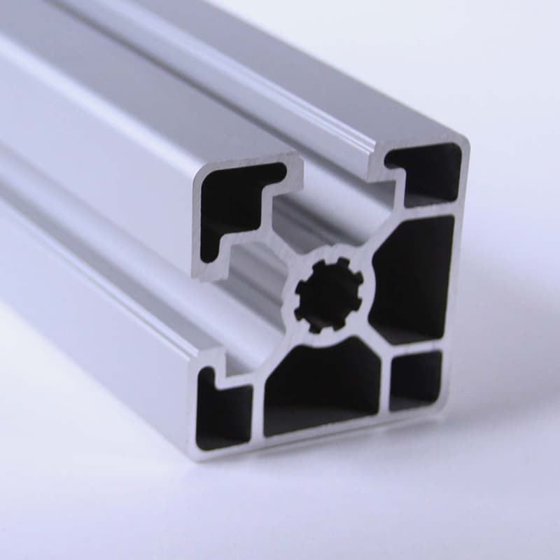 A close up of a piece of aluminum on a white surface