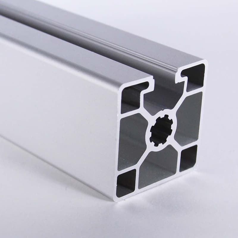 A close up of a piece of aluminum on a white surface