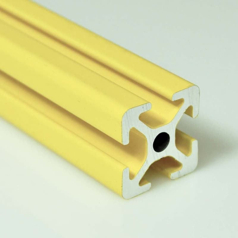 A yellow aluminum tube with a black hole in the middle