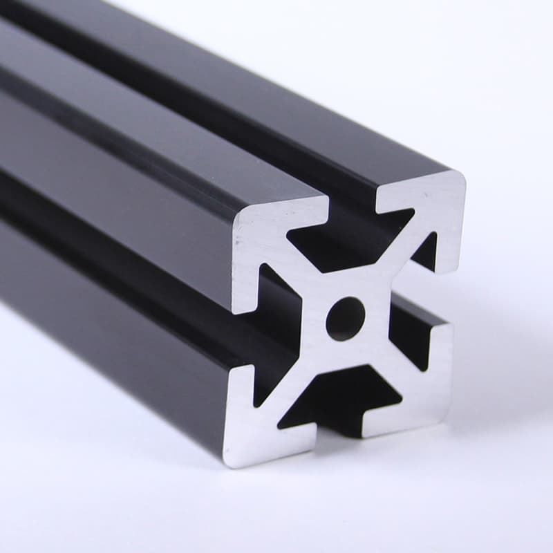 A black metal bar with a hole in the middle