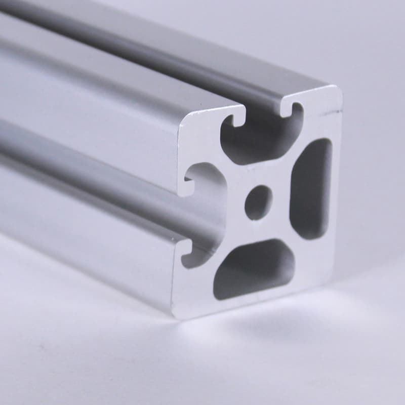 A close up of a piece of aluminum with holes in it