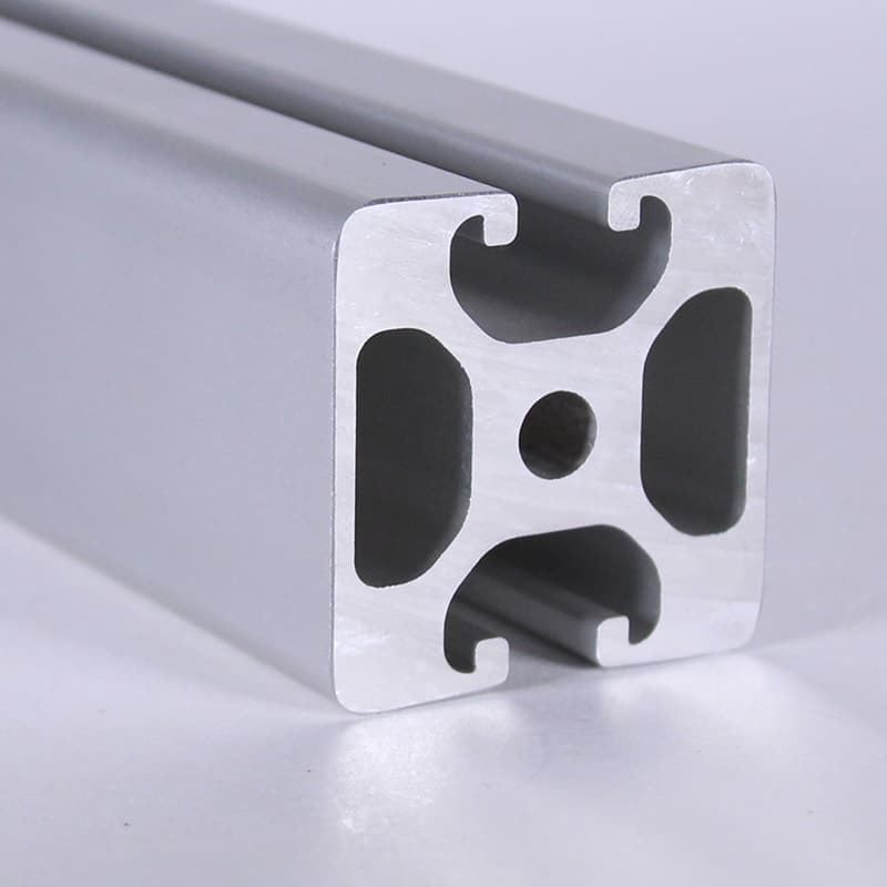 A close up of an aluminum beam with holes in it