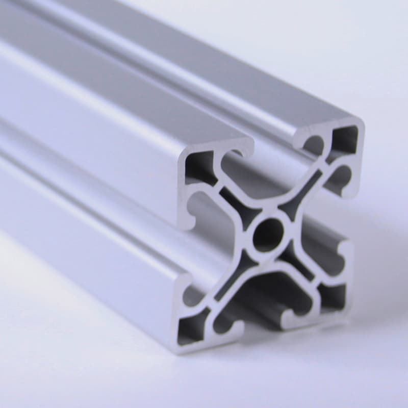 A close up of a piece of aluminum on a white surface