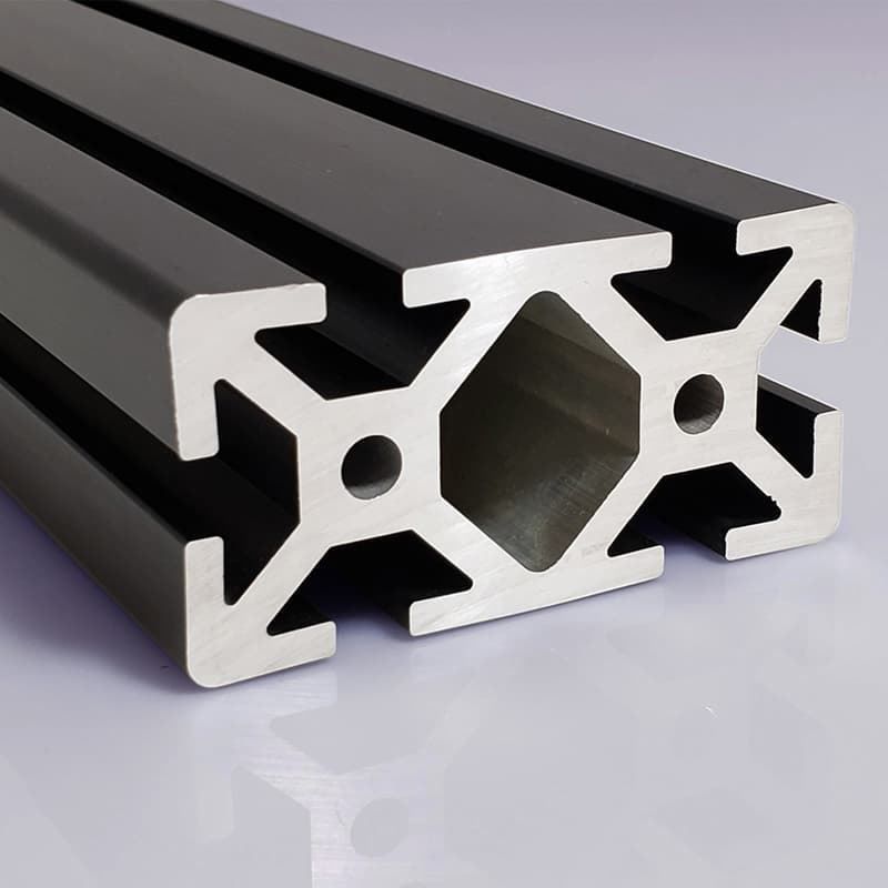 A close up of a metal beam with holes in it