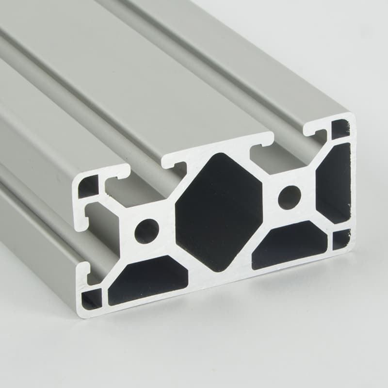 A close up of an aluminum beam with holes in it