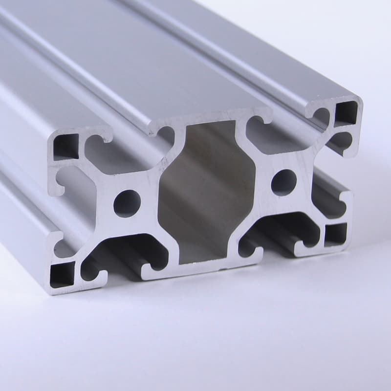 A close up of an aluminum beam on a white surface