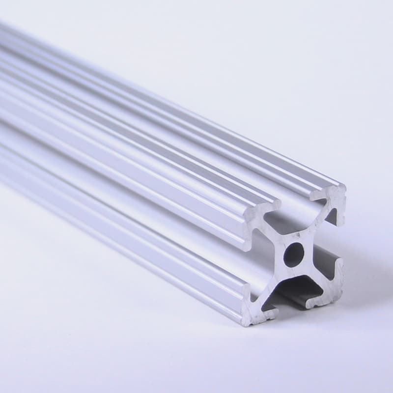 A close up of an aluminum tube on a white surface