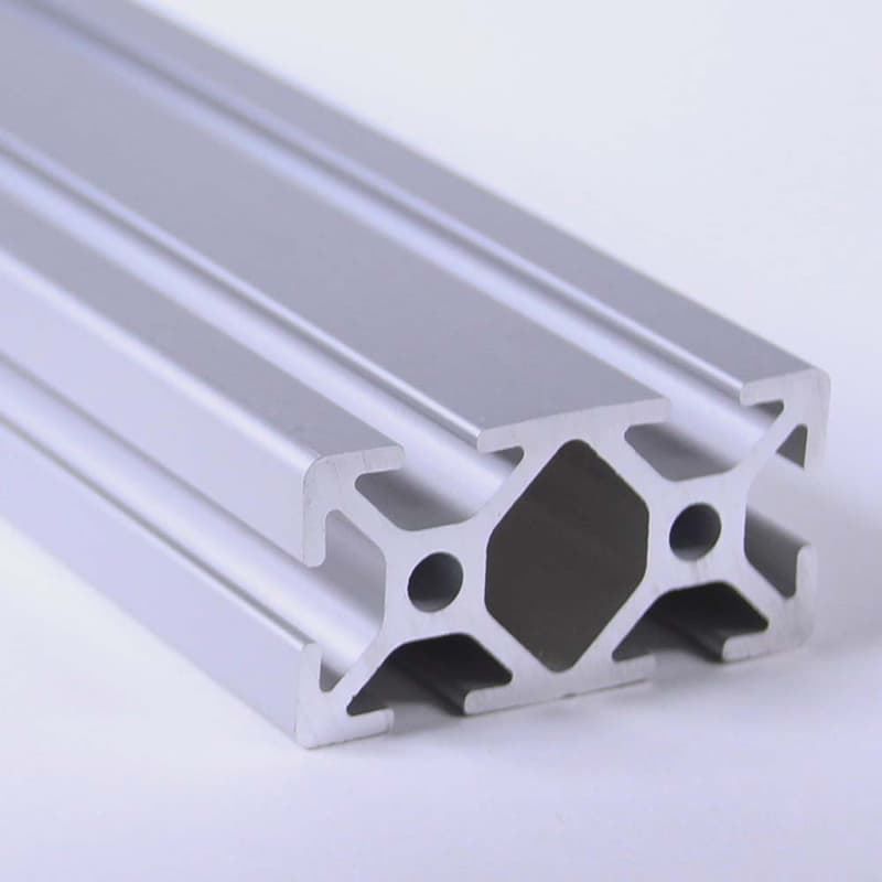A close up of an aluminum beam on a white surface