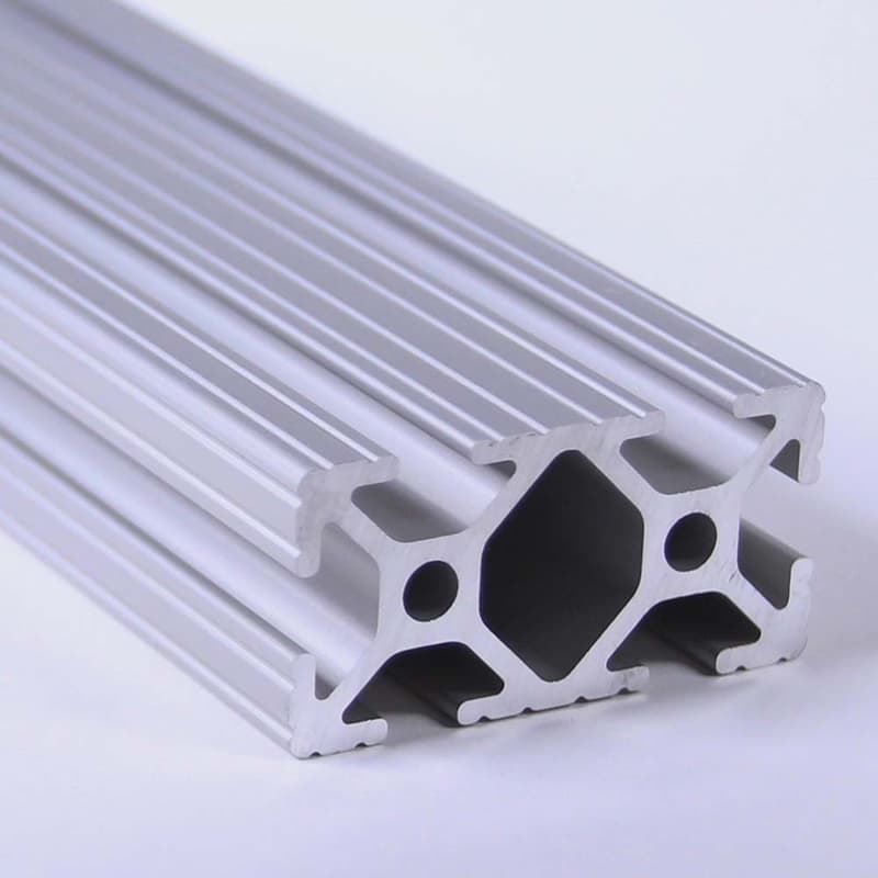 A close up of a piece of aluminum on a white surface