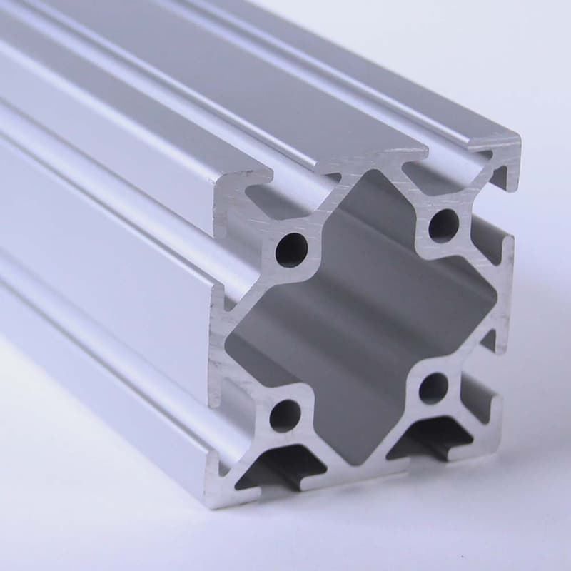 A close up of an aluminum beam on a white surface