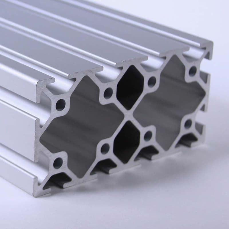 A close up of a piece of aluminum with holes in it