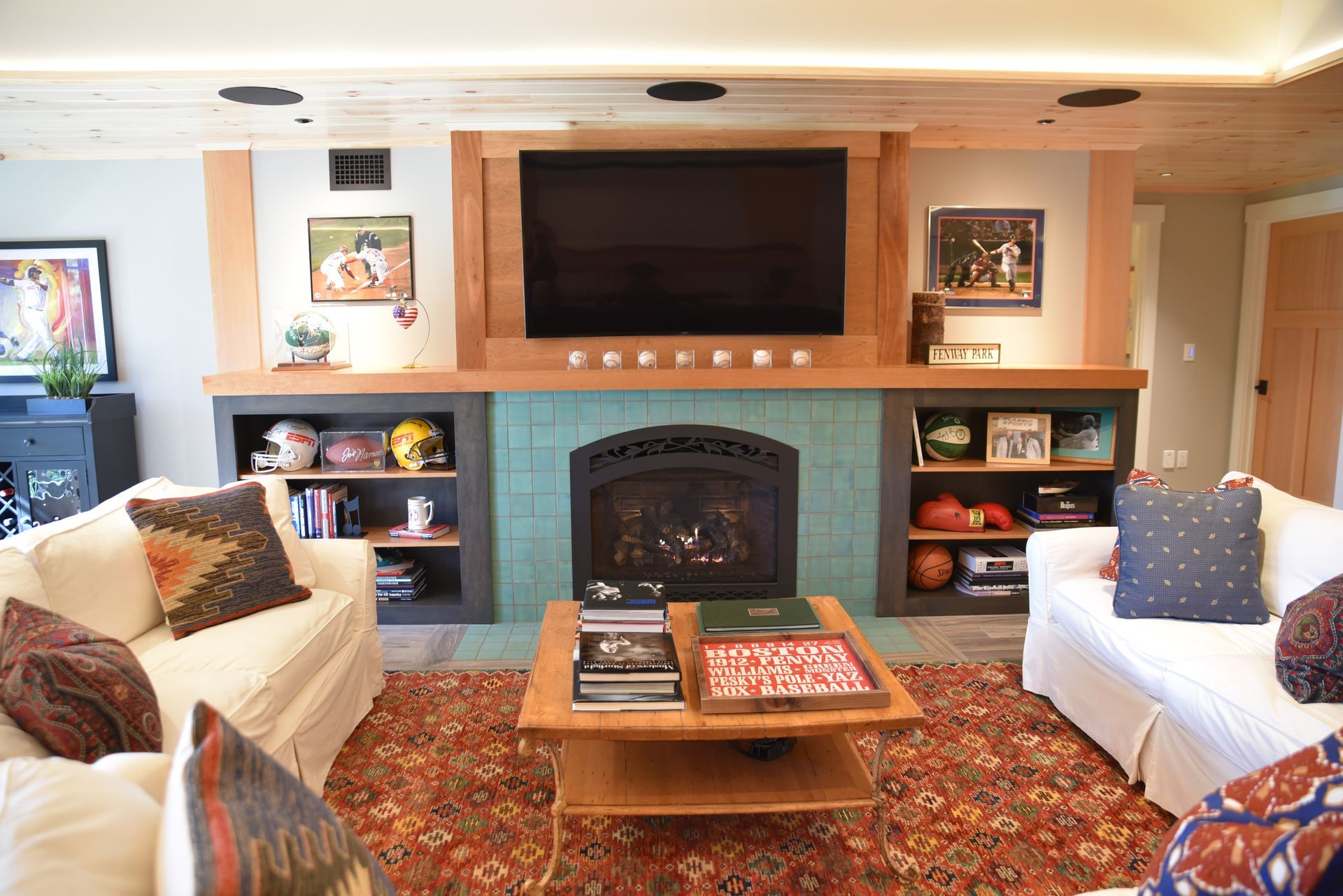 A living room with a fireplace and a flat screen tv