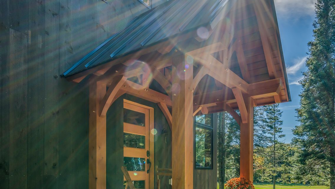 The sun is shining through the windows of a wooden house.