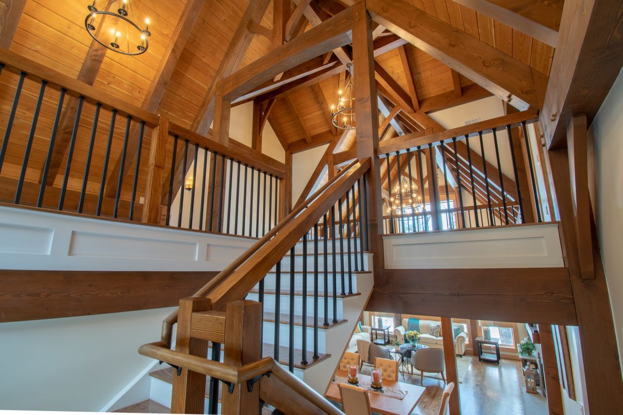 A wooden staircase leading up to the second floor of a house.