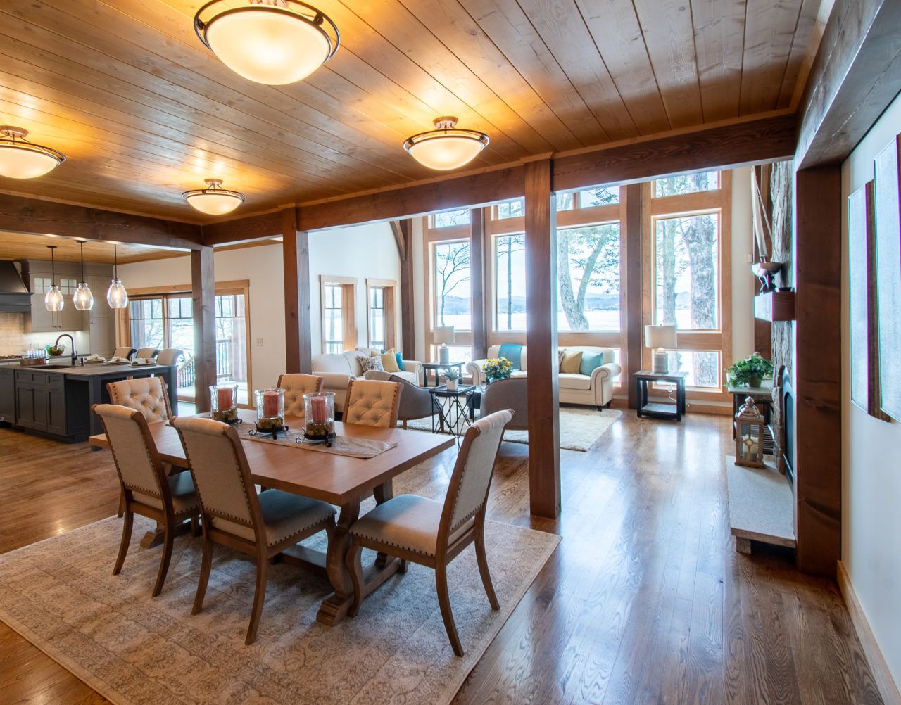 There is a dining table and chairs in the middle of the room.