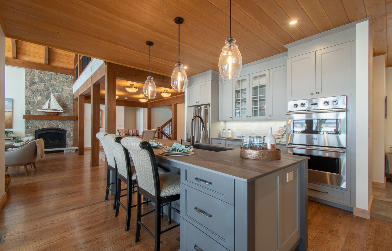 There is a large island in the middle of the kitchen.