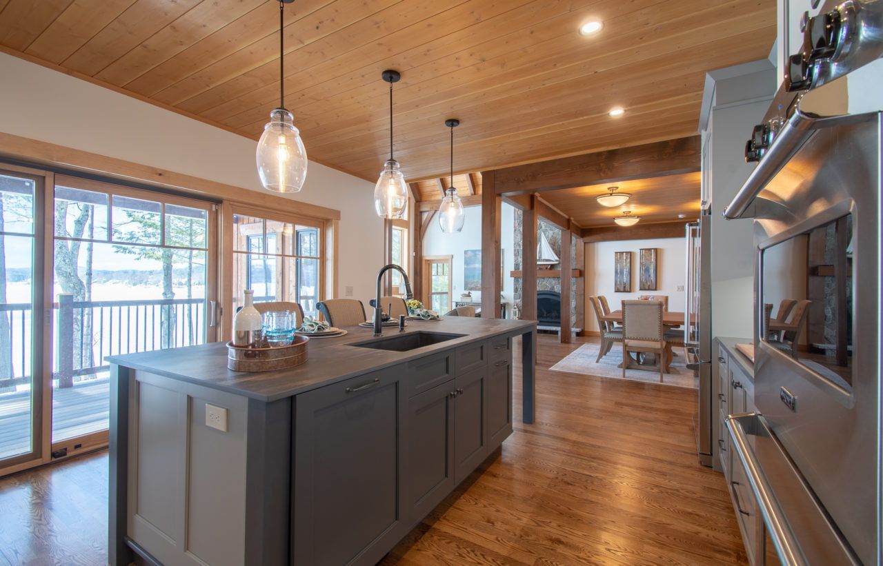 A kitchen with a large island in the middle of the room.