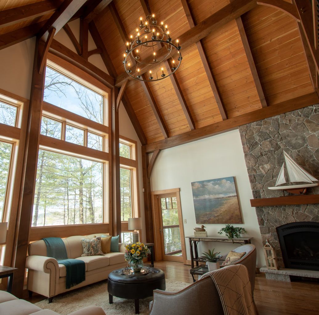 A living room with a chandelier hanging from the ceiling