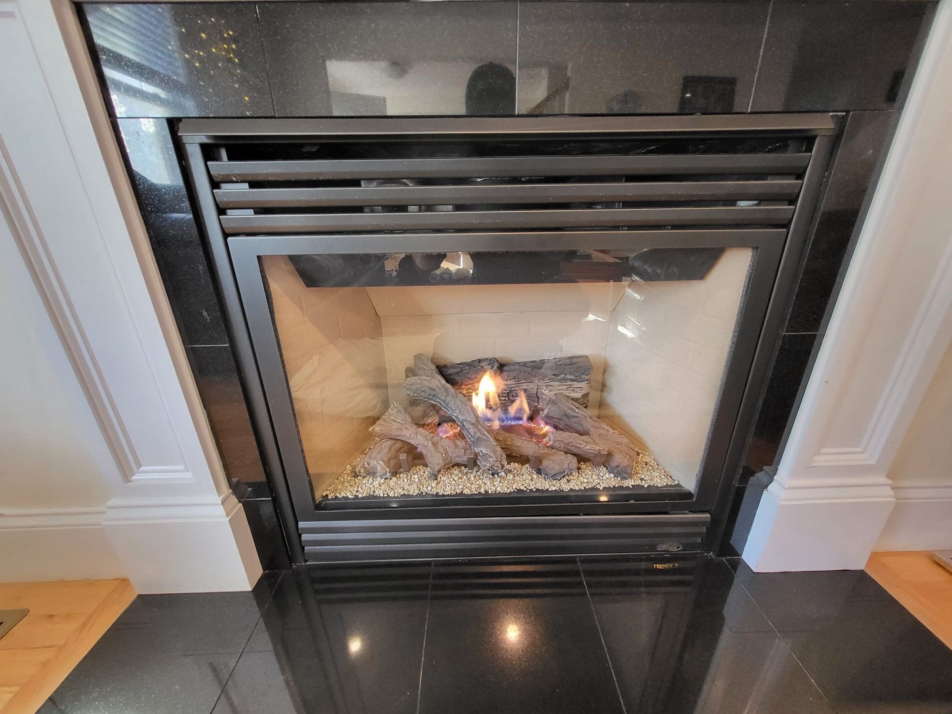 A fireplace with a lot of logs in it