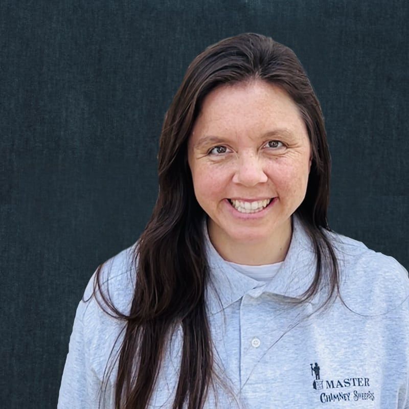 A woman wearing a grey shirt with the word master on it