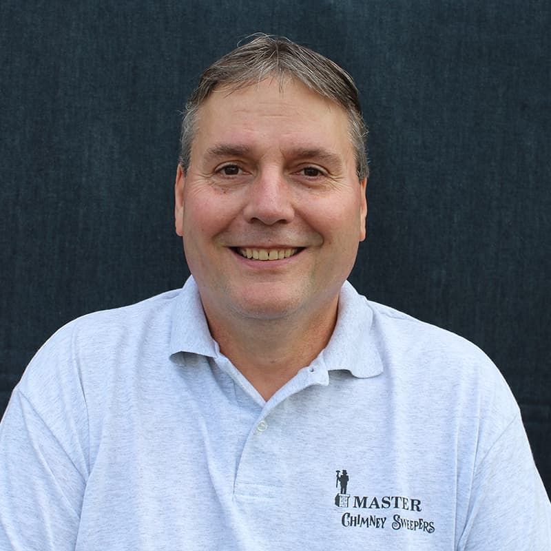 A man wearing a grey shirt that says master on it