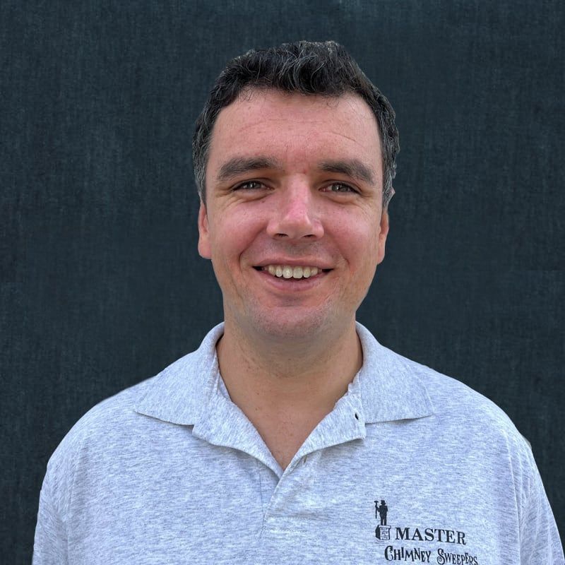 A man wearing a grey shirt that says master on it