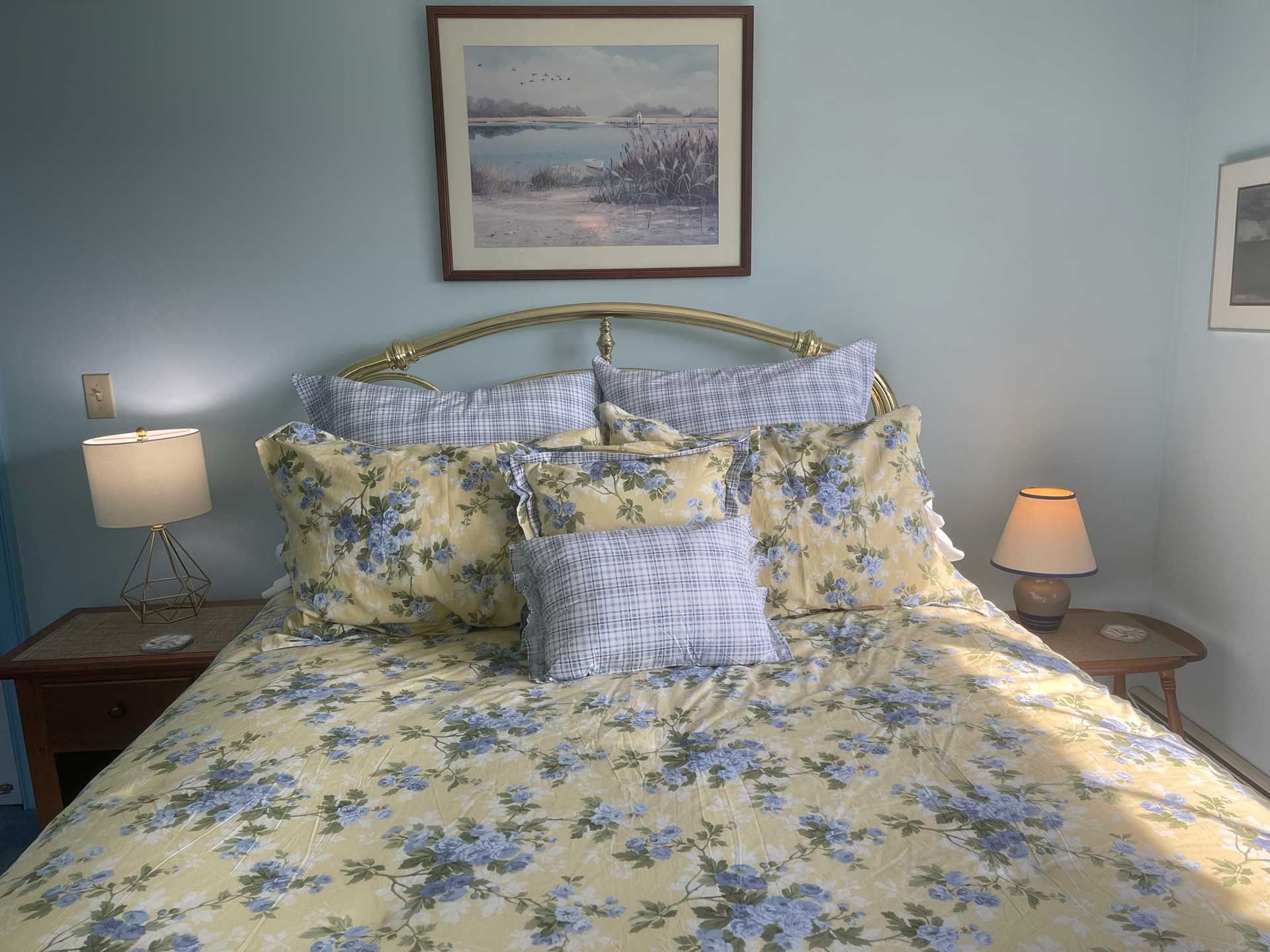comfortable bed with floral bedding