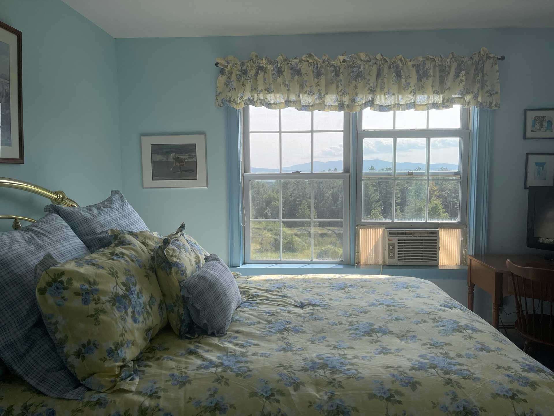 cozy bedroom with mountain view