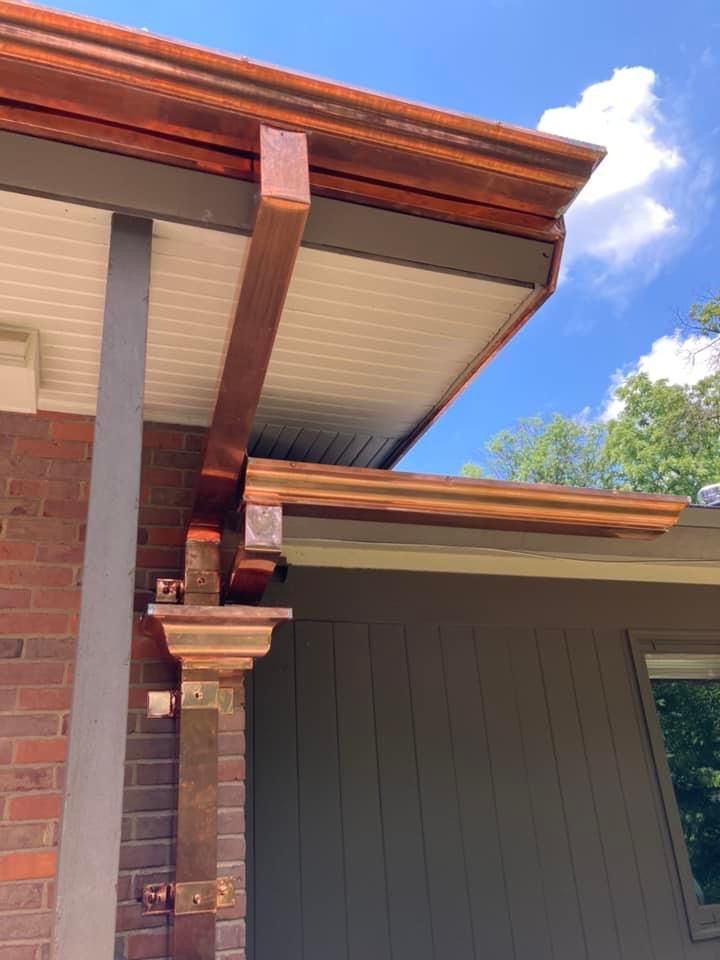 A man is working on the roof of a building.