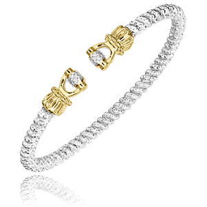 A gold and silver bracelet with diamonds on a white background