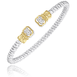 A silver and gold bracelet with diamonds on a white background