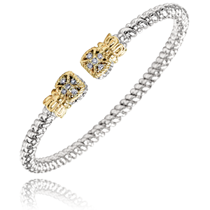 A silver and gold bracelet with diamonds on a white background