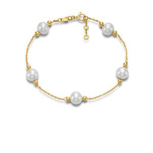 A gold bracelet with white pearls on a chain