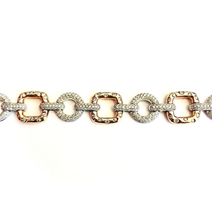 A close up of a bracelet with diamonds on a white background