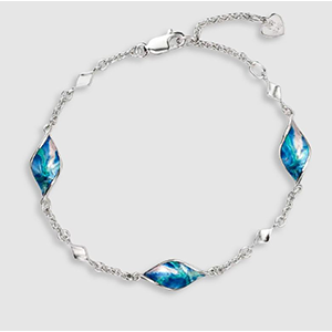 A silver bracelet with blue beads on a white background