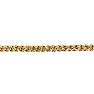 A close up of a gold chain with diamonds on a white background.