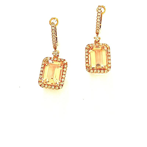 A pair of earrings with square shaped stones and diamonds
