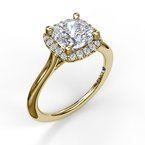 A yellow gold ring with a diamond in the center surrounded by smaller diamonds.