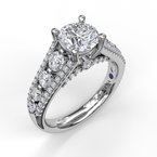 A white gold engagement ring with a round diamond in the center surrounded by smaller diamonds.