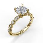 A yellow gold engagement ring with a diamond in the center.