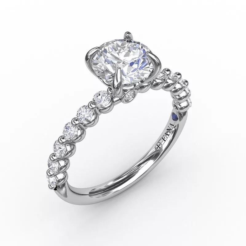 A white gold ring with a diamond in the center
